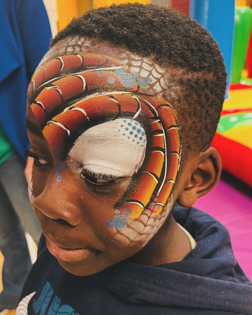 Boy with spiderman face paint in Telford