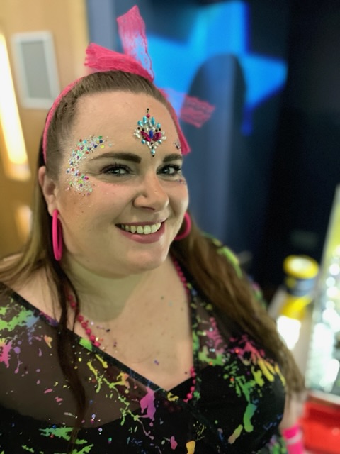 Lady with glitter and gems on her face at a party in Shrewsbury