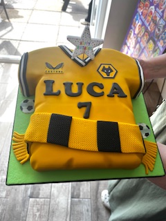 Birthday cake in shape of Wolves Football shirt