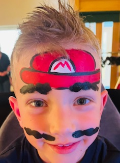 Boy with Mario face painting in Shrewsbury