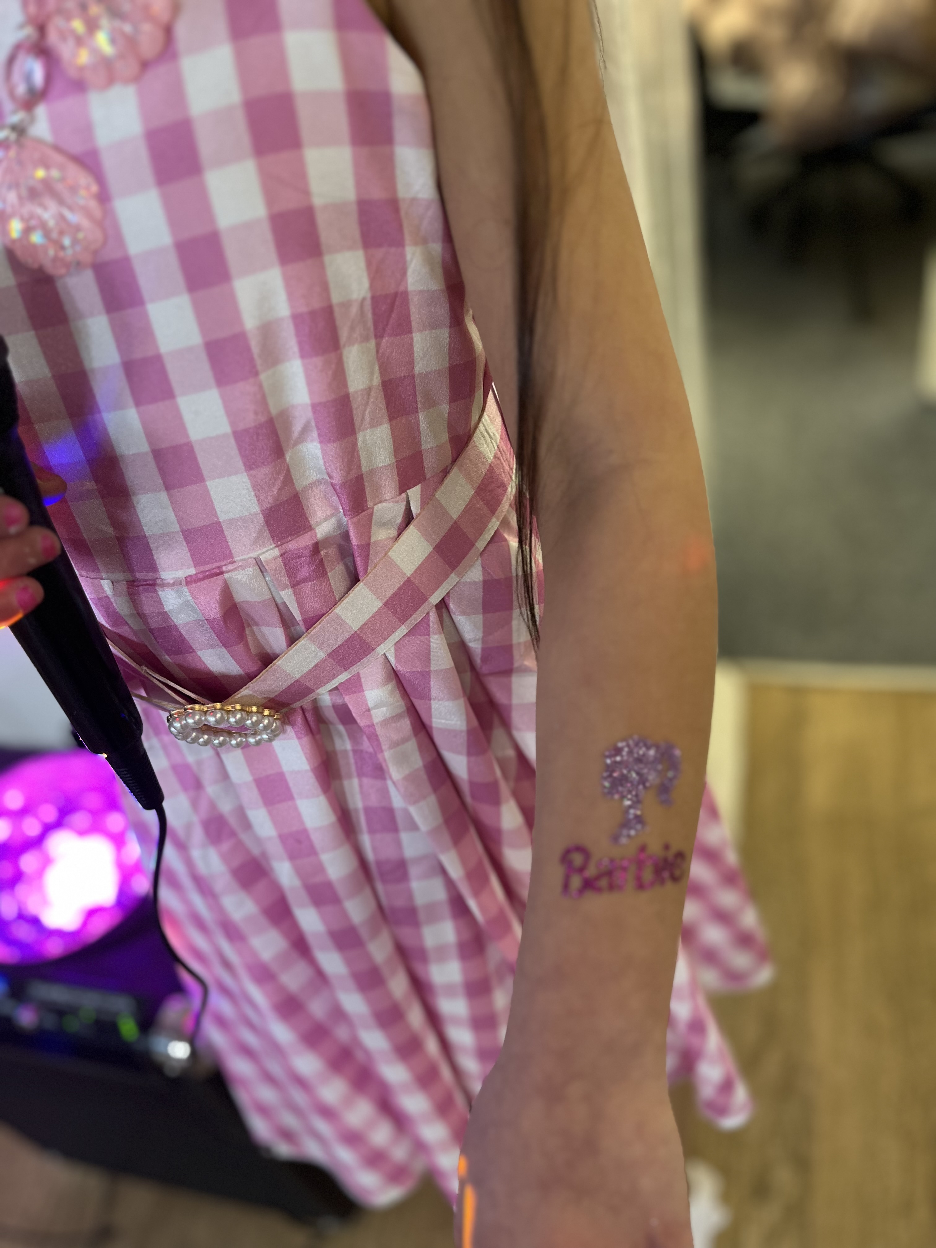 Barbie glitter tattoo on girls arm