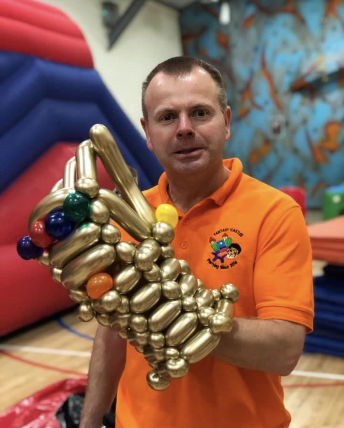 man wearing Thanos gauntlet glove made from balloons